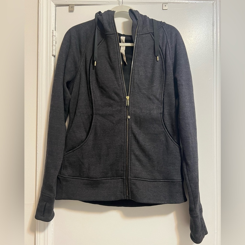 Black Lululemon hoodie. Fleece lined with gold metal detailing